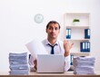 © Elnur - Young male employee unhappy with excessive work