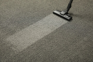 Canvas Print - Vacuuming grey carpet. Clean area after using device. Space for text