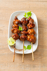 Wall Mural - grilled chicken gizzard skewer with herbs and spices