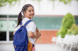 © FAMILY STOCK - Back to school. Cute Asian child girl with a backpack running and going to school with fun
