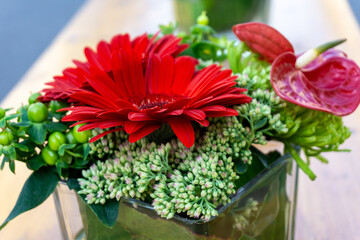 Wall Mural - Flower in glass pot on a table