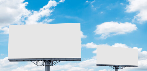 Two pole outdoor billboard with blue sky background