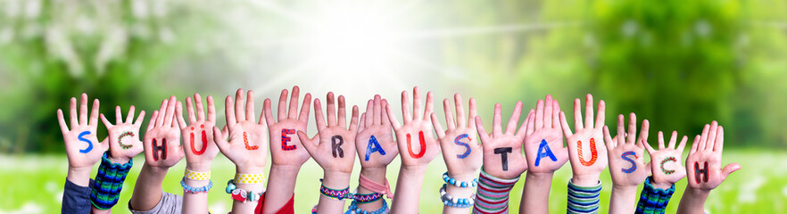 Wall Mural - Children Hands, Schueleraustausch Means Student Exchange, Grass Meadow