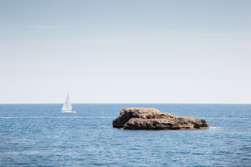 Sticker - small rock island just beyond the shoreline