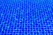 canvas print picture - The blue tiles floor under the clear water in the swimming pool background, Swimming pool surface with floor mosaic tiles in blue