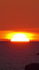 Wall Mural - beautiful landscape with sea sunset, long focus. vertical video