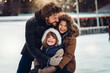 © Kalim - AI generated image of happy family on ice ring