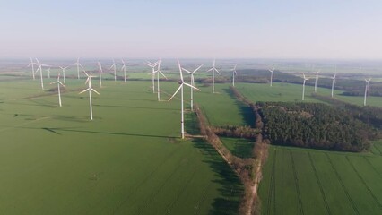 Wall Mural - Aerial flight over a wind farm in Germany. Drown pan down