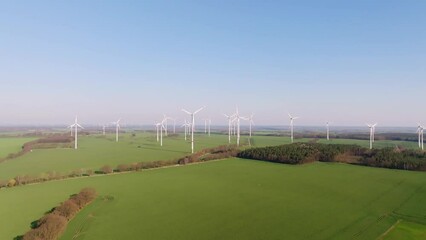 Wall Mural - Aerial flight over a wind farm in Germany. Drone move to the right