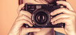 © Yevhen - Cheerful smiling child holding a cameras. Little boy on a taking a photo using a vintage camera