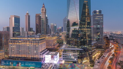 Wall Mural - Dubai International Financial district aerial day to night timelapse. Panoramic view of business and financial office towers.