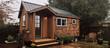 © AdriFerrer - Cozy tiny house on wheels in a domestic backyard setting.