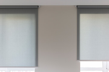Leinwandbilder - Roller blinds automatic close-up on the window. Selective focus. Motorized shades. Gray color curtains, texture fabric. City outside the window.