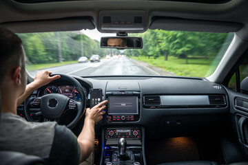 Wall Mural - Hands on the wheel when driving from inside the car.