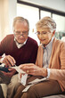 Senior couple, finance and bills in budget check for expenses, receipts or calculating costs at home. Elderly man and woman in financial discussion, accounting or investment plan, payment or savings