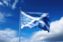 Scottish Flag Flying In The Wind On A Flagpole Against A Blue Sky With Clouds. Blue White Flag Of The Scotland Wallpaper.  