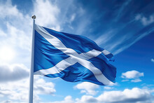 Scottish Flag Flying In The Wind On A Flagpole Against A Blue Sky With Clouds. Blue White Flag Of The Scotland Wallpaper.  