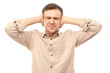 © amixstudio - Portrait of nervous young man covering ears with hands isolated on white background. Stress, emotional burnout, self-doubt concept