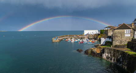 Wall Mural - Coverack harbour landscape with rainbow and stormy skies