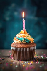 Wall Mural - birthday cupcake with a single lit candle, created with generative ai
