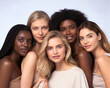 © STORYTELLER - Beauty. Group Of Diversity Models Portrait. Multi-Ethnic Women With Different Skin Types Posing On Beige Background. Tender Multicultural Girls Standing Together And Looking At Camera