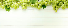 Green And Black Juicy Grapes On White Background. Autumn Frame Made Of Grapes . Copy Space For Text Or Menu On White Wooden Background. Fruit Berry Frame Border Long Web Banner. Digital Ai