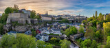 Fototapeta Paryż - Grand Duchy of Luxembourg, sunset city skyline at Grund along Alzette river in the historical old town of Luxembourg