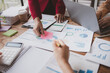 © PHOTO4U - Businessman is reviewing monthly sales documents for analysis and marketing plans for more sales growth, they are the founders of young companies co-founding startups. Sales management concept.