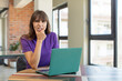 © kues1 - young pretty woman with mouth and eyes wide open and hand on chin.  desk laptop concept