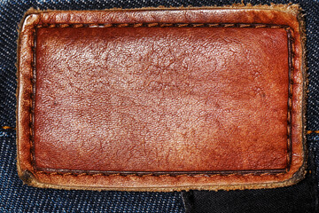 closeup of jeans with blank brand leather patch