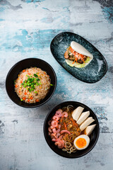 Wall Mural - Rice with chicken, dashi broth and flatbread with beef and vegetables.