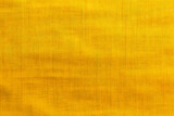 Fototapeta  - yellow fabric texture with subtle horizontal lines and variations close up