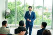 © FotoArtist - conference meeting. Business people sitting in a room listening to the motivator coach. Representation of a Self-growth and improvement special event
