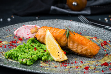 Wall Mural - Salmon fillet with broccoli puree, lemon and red caviar, fresh dinner.