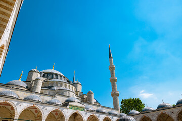 Domes and minarets of Sultanahmet or Blue Mosque from courtyard.