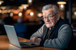 © Patrick Helmholz - Old man working on laptop