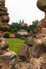 Wall Mural - Summer rural environmental landscape. Ruins of the Rezekne Castle Hill with dramatic sky. Tourists look at urban ruins. Rezekne, Latvia