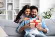 © Prostock-studio - Cheerful indian couple celebrating birthday, anniversary at home