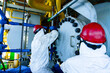 © MR.Zanis - A worker cleaning an internal pressure vessel in a confined space puts a bolt to close the pressure vessel.