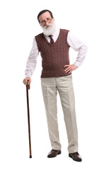 Wall Mural - Senior man with walking cane on white background