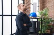 © Krakenimages.com - Young caucasian man business worker standing with arms crossed gesture and worried expression at office