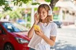 © Krakenimages.com - Young blonde girl smiling confident listening to music at street