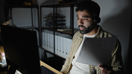 Wall Mural - Young hispanic man business worker having video call holding document at office