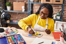 African American Woman Artist Smiling Confident Mixing Color At Art Studio
