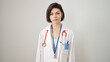 © Krakenimages.com - Young caucasian woman doctor standing with serious expression over isolated white background