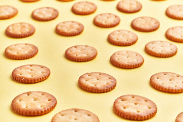 Wall Mural -  Delicious group of salty biscuits over isolated yellow background