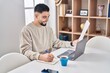 © Krakenimages.com - Young arab man sitting on table studying at home