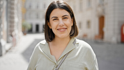 Sticker - Young beautiful hispanic woman smiling confident standing at cafeteria