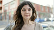 © Krakenimages.com - Young beautiful hispanic woman standing with serious expression at street