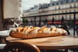 A freshly baked baguette on a table in a Parisian cafe
